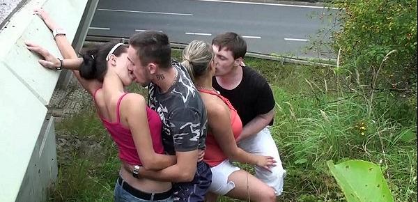  A girl with huge natural tits and a young teen chick fucked in a public street foursome by 2 hung guys with big dicks doing oral deep throat oral blowjob and sexual intercourse in the doggy style position and cum on her gorgeous big natural boobs